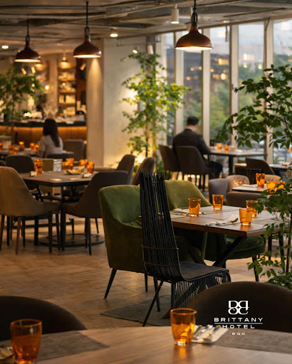 A high-end, sophisticated luxury hotel lobby with warm ambient lighting