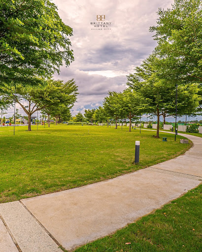 Modern, upscale road corridor in the Philippines at dusk near Evia Lifestyle Center